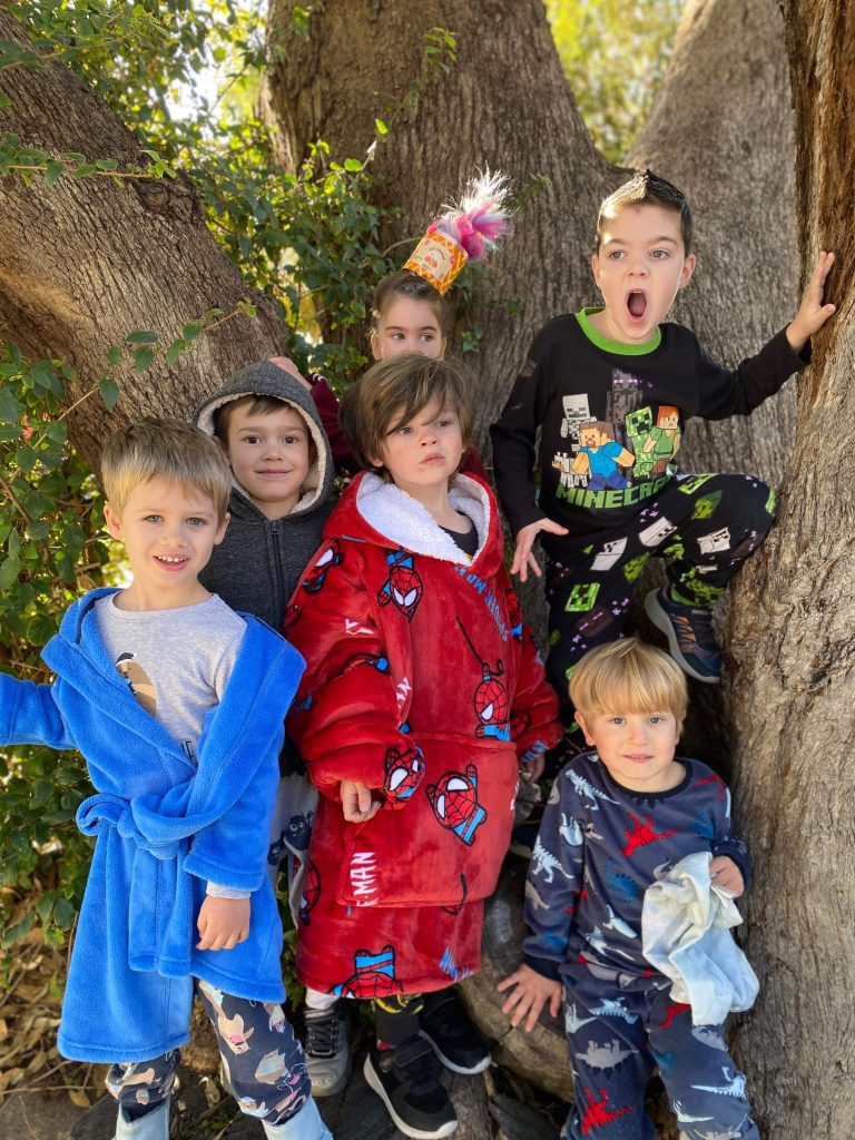 Collection of students in a tree all wearing pjs